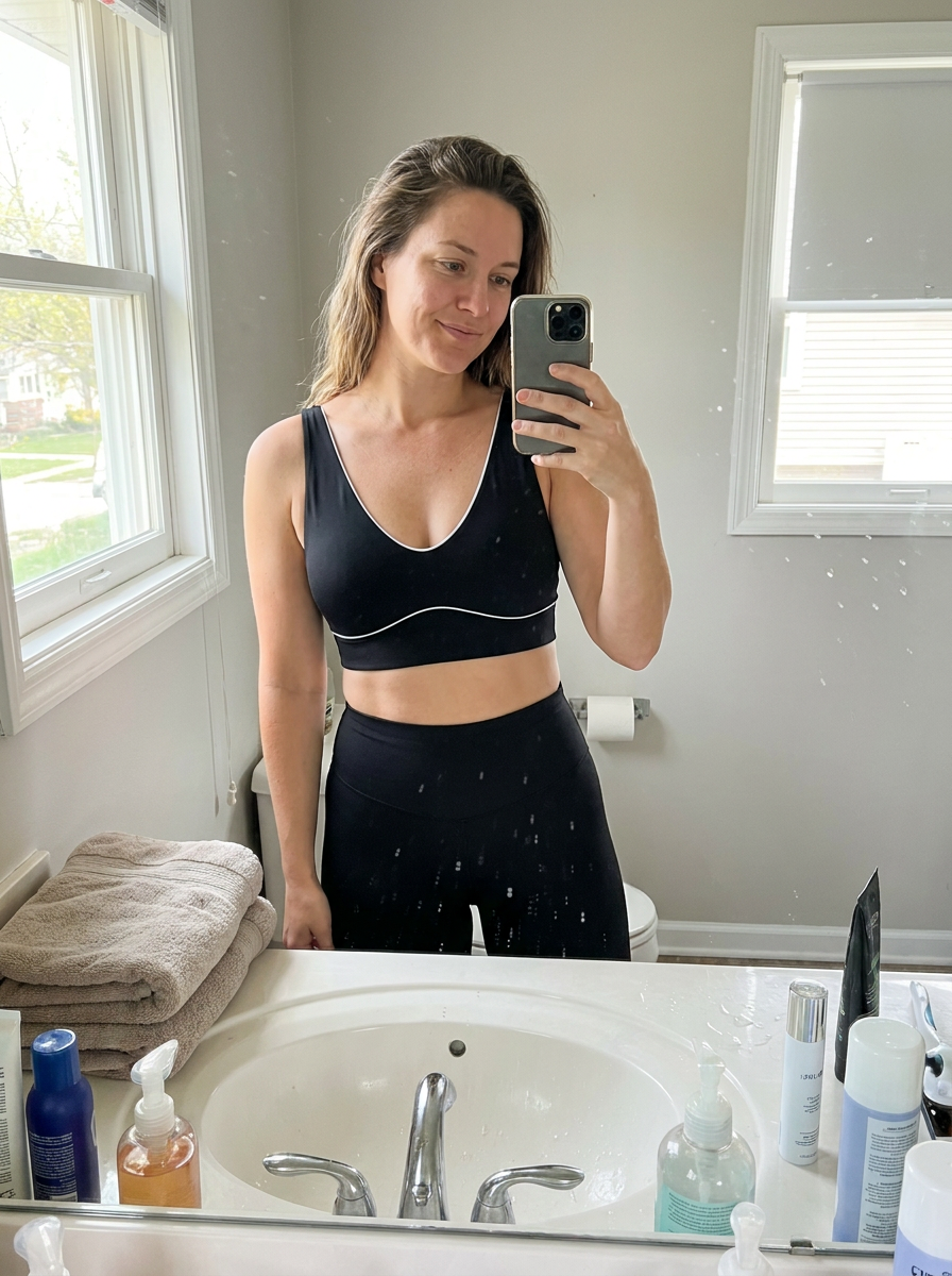 Customer in black SilkContour, bathroom mirror selfie